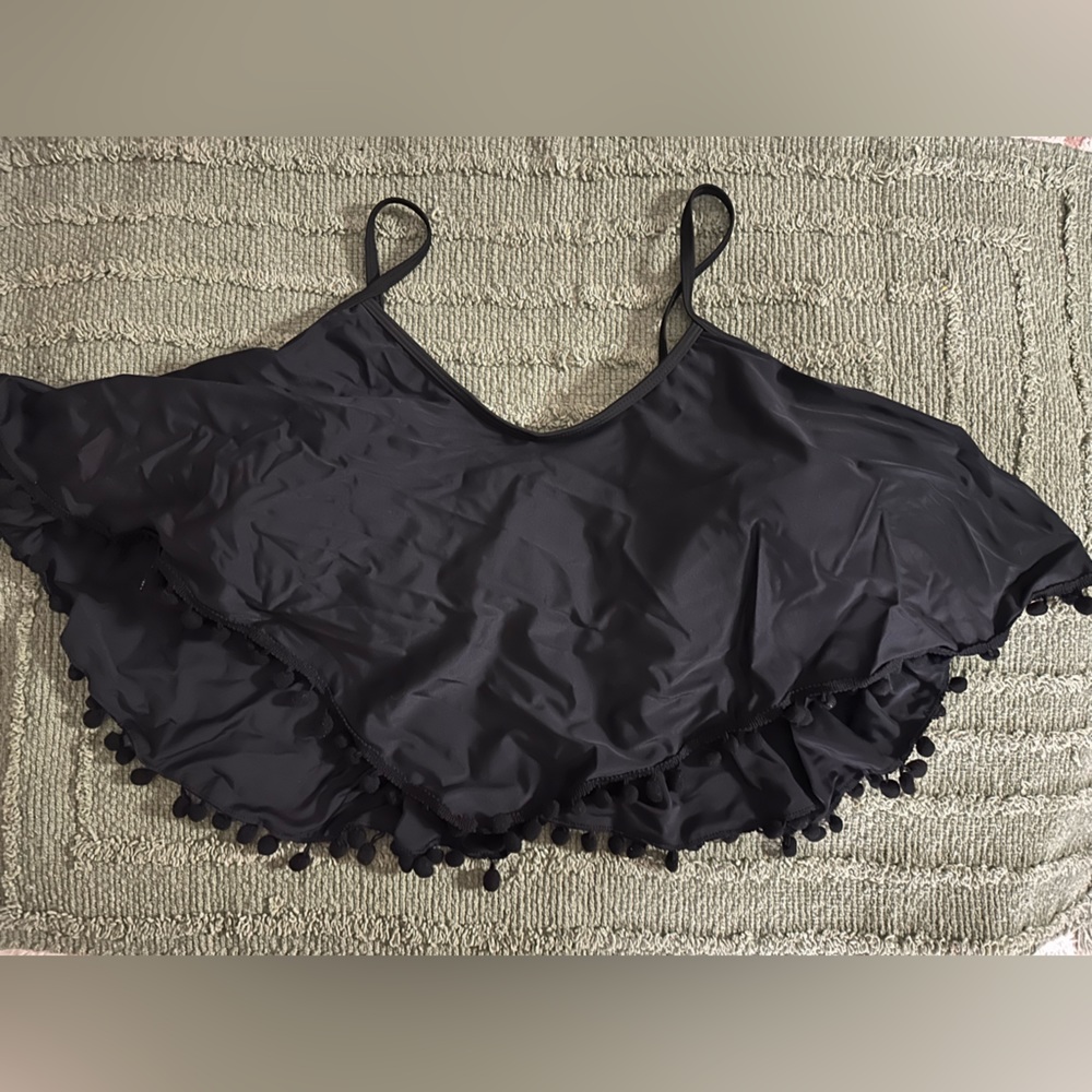 Black bathing suit top with fringe and bra underneath